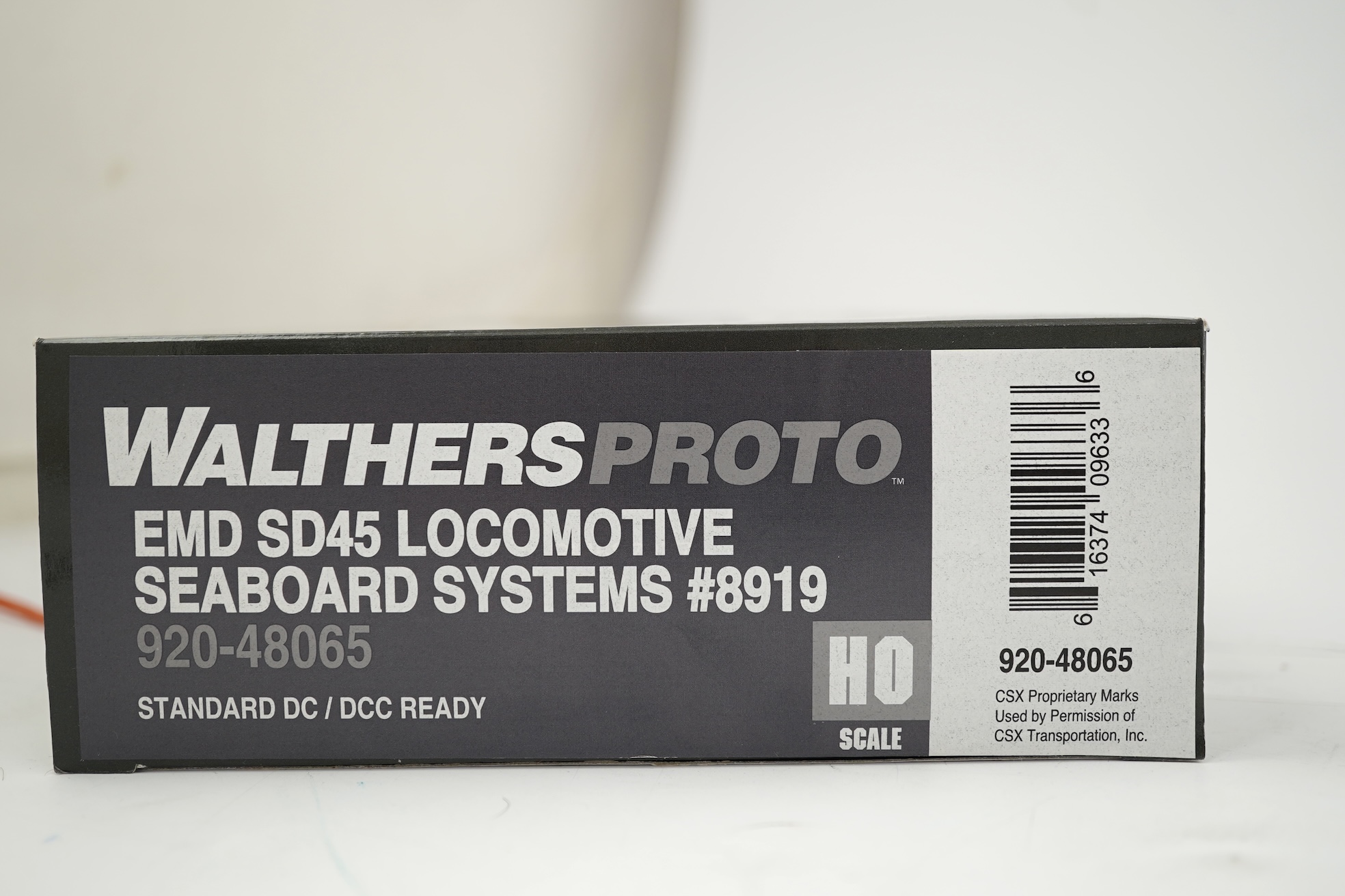 A boxed HO gauge Walthers Proto American outline Seaboard System Co-Co diesel locomotive, 8919, (920-48065).